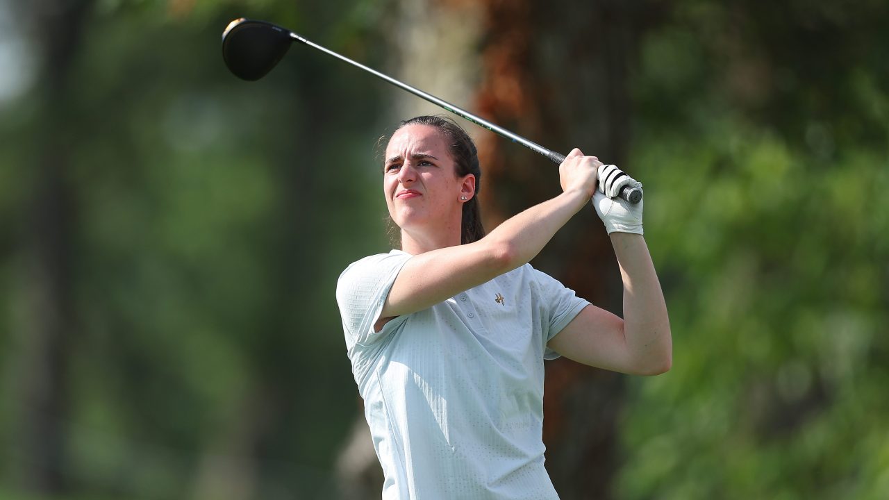 Caitlin Clark plays a shot during golf pro-am